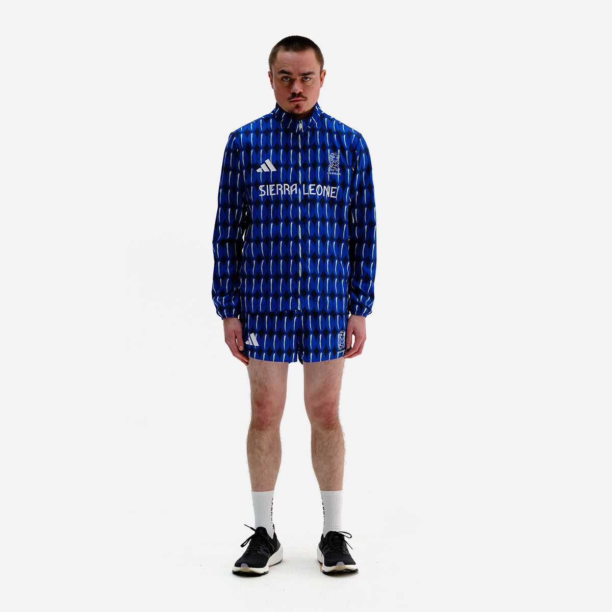 LABRUM x adidas Team Sierra Leone blue track jacket with signature cowrie shell print, designed for the Paris 2024 Olympic Games